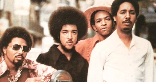 Vintage 1970s Black Soul Music Band group photo showcasing musicians with natural hairstyles and stylish clothing, capturing the cultural spirit of music history captured by Past Daily archive.