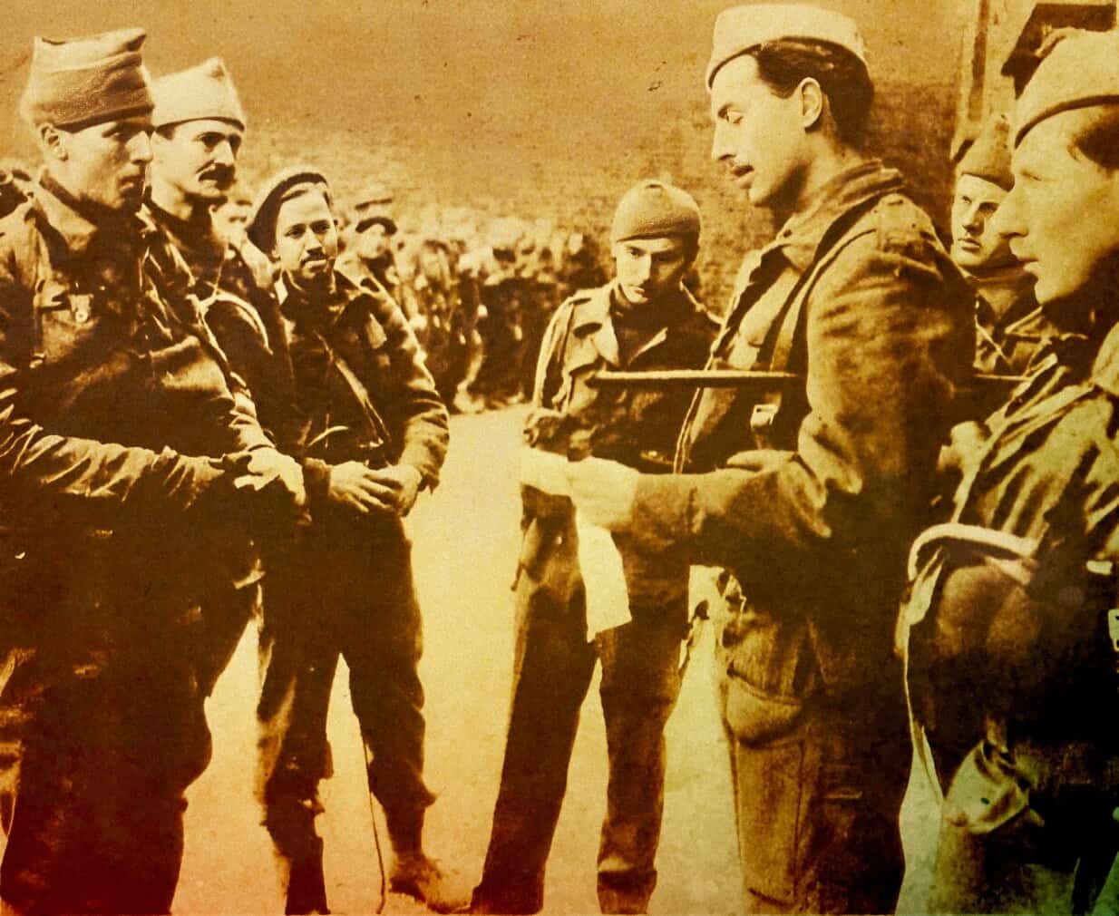 Hulton-Deutsch Collection WWII soldiers consulting during wartime briefing historical military context historical photo of soldiers in uniform focusing on military history and news archive.