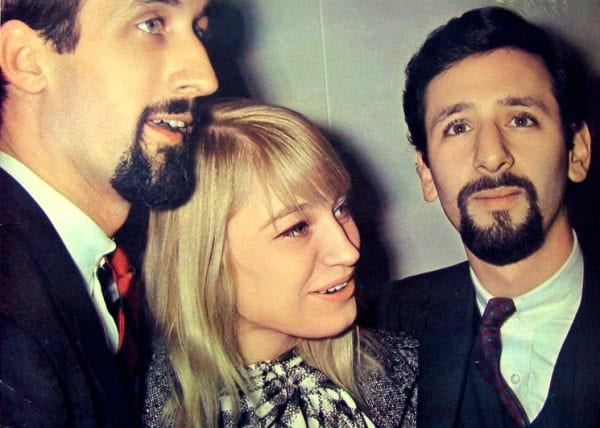 Close-up of three people at a news and music event, showcasing historical sound recordings and archival media.