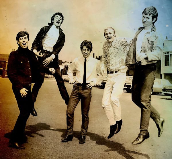 Jumping teenagers in a street scene from the 1960s, showcasing youth culture, music, and nostalgic moments, perfect for historical and music archive images.