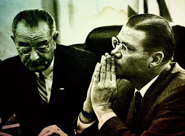Listening attentively to important news or political discussion, two men in formal suits in a black-and-white historical photo.