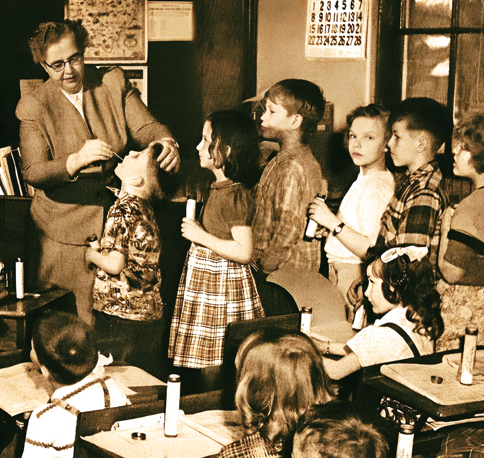 Nurturing children's education in a vintage classroom with a teacher demonstrating a medical procedure, emphasizing nostalgic school environments, historical education scenes, and classic classroom activities.
