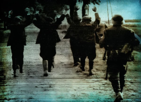 Sunset military personnel walking along a dirt road, historical wartime scene capturing soldiers in uniform during a significant moment in history.