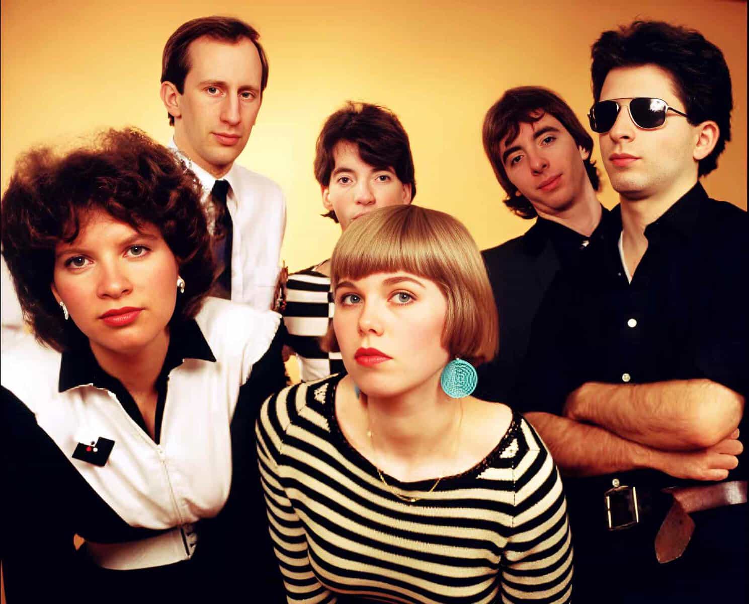 Vibrant image of The Bangles, a 1980s American pop rock band, showcasing members with distinctive 80s fashion and hairstyles, emphasizing music history and iconic pop culture.