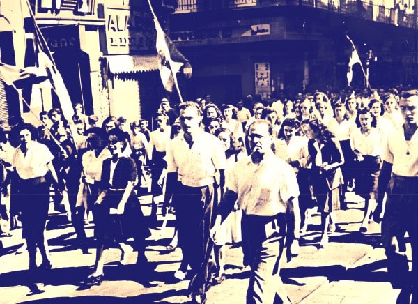 Marching students in a historical demonstration, vintage black and white photo, educational protest, youth activism, 20th-century history, peaceful demonstration, social movement.