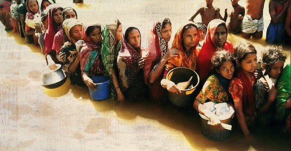Children waiting in line to collect water, reflecting community resilience and access to clean water in rural areas.