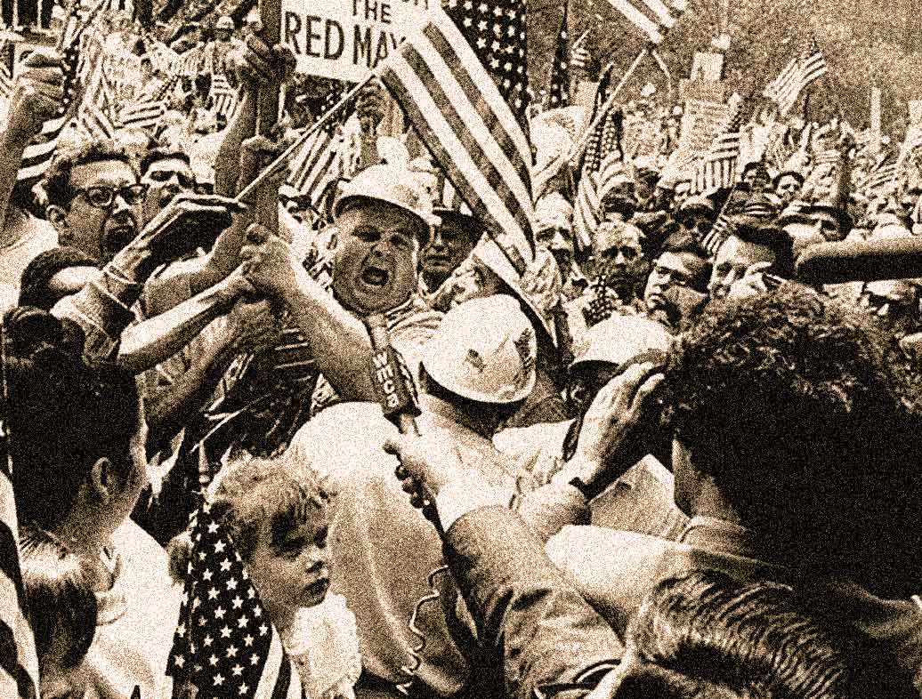 Protesters and flag-waving crowd during the 1960s civil rights demonstration, emphasizing American history and social activism.