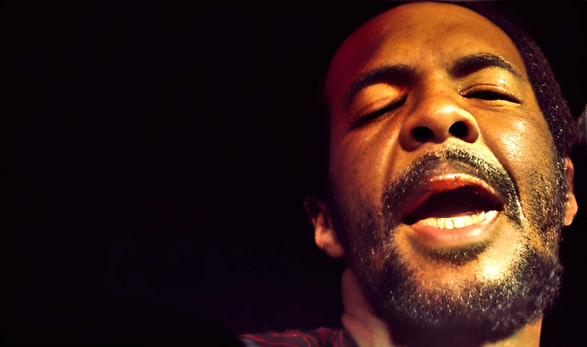 Vocalist passionately singing blues music on stage at a music event, capturing the essence of jazz, soul, and classic American music history for archival sound collection.
