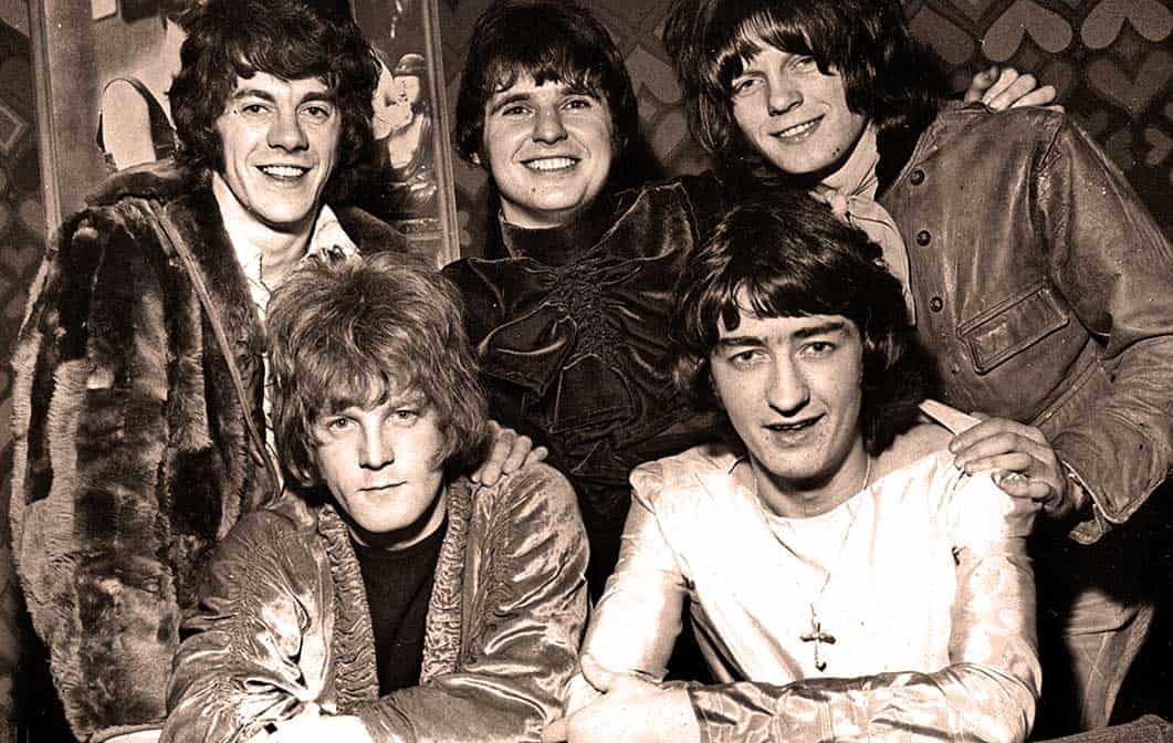 1970s iconic rock band members in black and white photo, showcasing classic musicianship, vintage fashion, and musical history perfect for music archives and history enthusiasts.