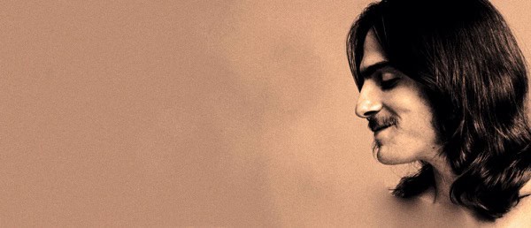 Vintage woman with dark hair and a peaceful expression, symbolizing music and history archives.