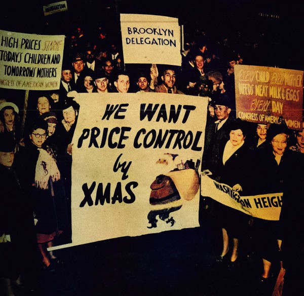 Protesters holding signs demanding price control by Christmas, advocating for workers' rights and affordable living during a historic labor demonstration.
