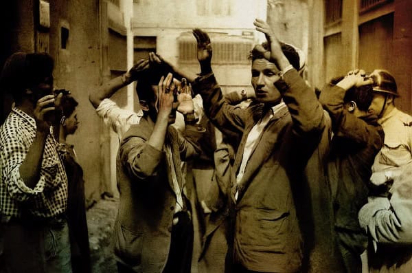 Children and adults protesting or demonstrating in a vintage black-and-white photo, emphasizing social activism, protests, and historical community movements.