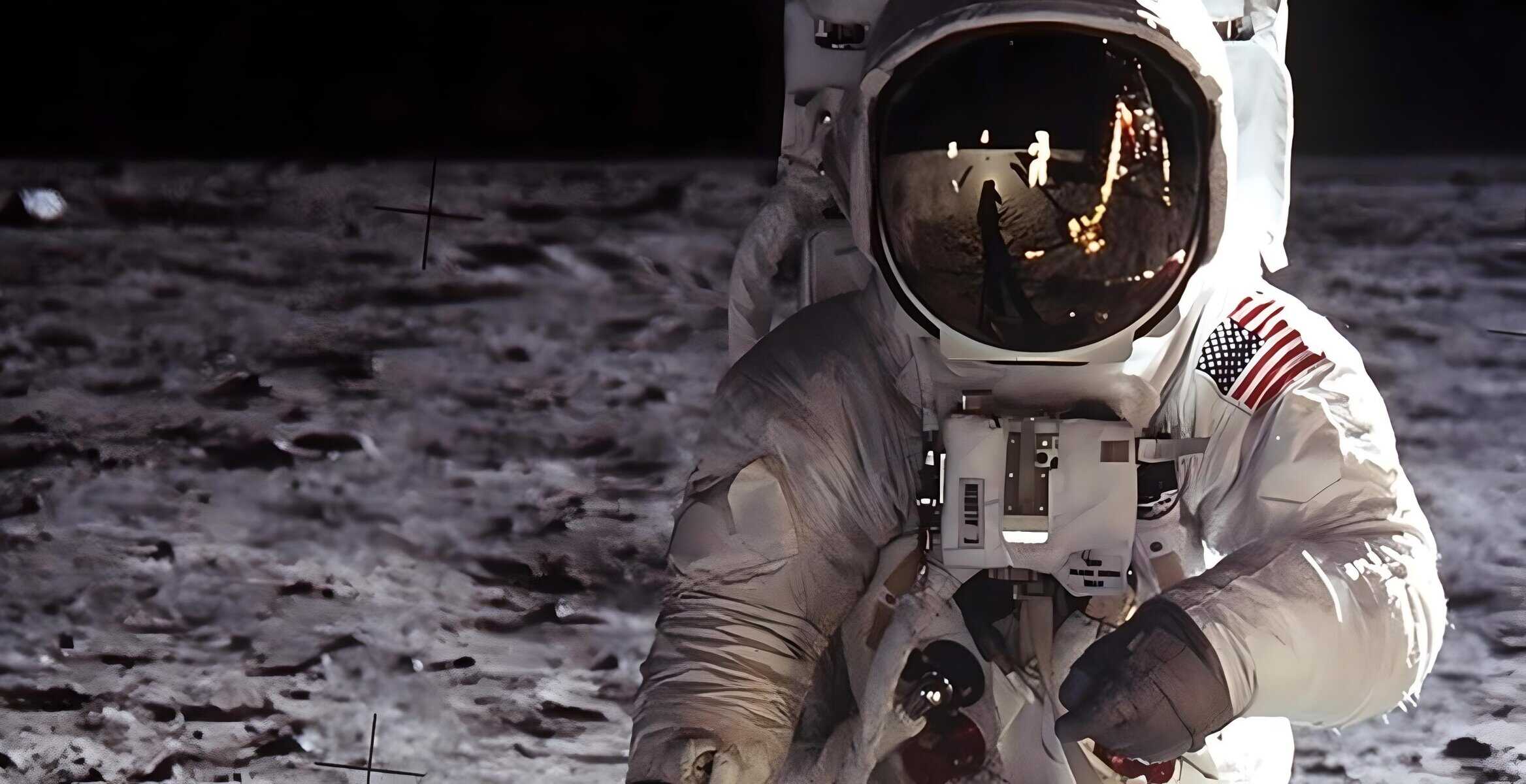 Moon landing astronaut on lunar surface with reflection of flag and Earth in helmet visor.