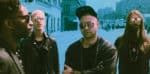 Unique band members wearing sunglasses and leather jackets outdoors, reflecting music culture and history, suitable for exploring past daily news, history, and music archives.