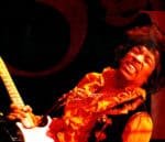 Blues singer with an electric guitar performing passionately, capturing the essence of blues and rock music, emphasizing historical music archives and iconic artists in the music industry.