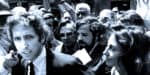 History of political protests and media coverage in the 1960s, featuring notable figures and journalists capturing significant moments in news broadcasting and social movements.