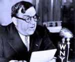 Portrait of a man with glasses reading news at a radio station, representing historic news archive coverage.