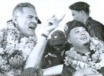 World War II veterans celebrating victory with floral garlands, highlighting historical news, war heroes, and patriotic moments archived in sound recordings.