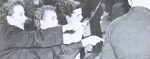 Women protesting during a historical demonstration, highlighting activism and social movements.