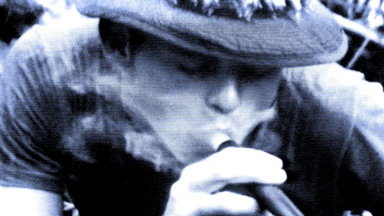 Historic black and white photograph of a woman with a wide-brimmed hat enjoying jazz music, capturing vintage era ambiance and nostalgic sound archive of news, history, and music.