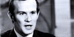 Black and white historical photo of a man speaking, representing news and history archives, suitable for past daily sound archive of news, history, and music.