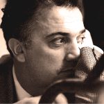 Vintage black and white image of a man in deep thought, showcasing classic film noir style, reflecting themes of history, news, and music archives on Past Daily.