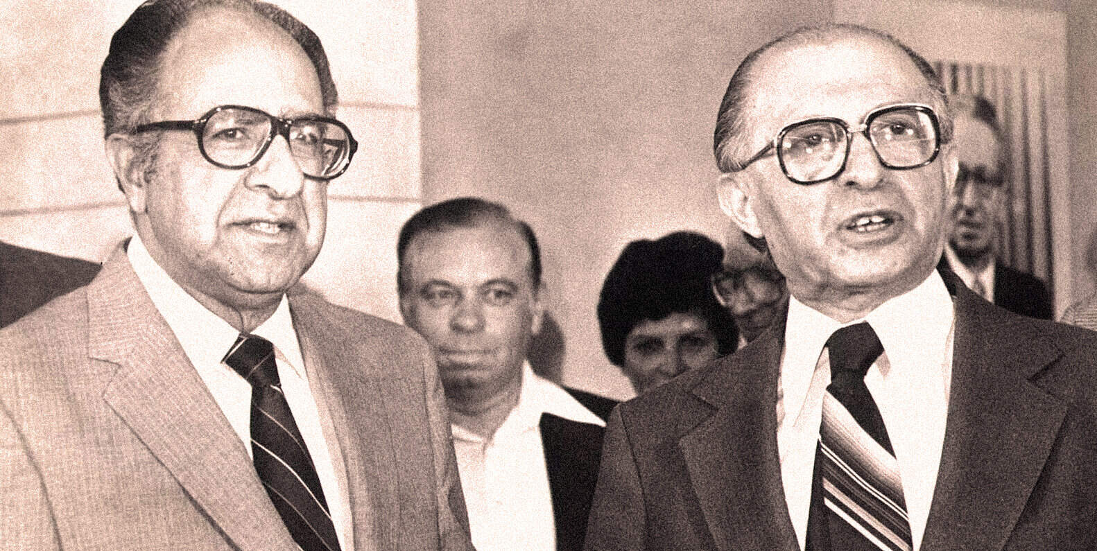 Serious men in suits and glasses at a formal event, historical black-and-white photo, notable figures in political or news history, vintage appearance, reminiscent of mid-20th century news photos.