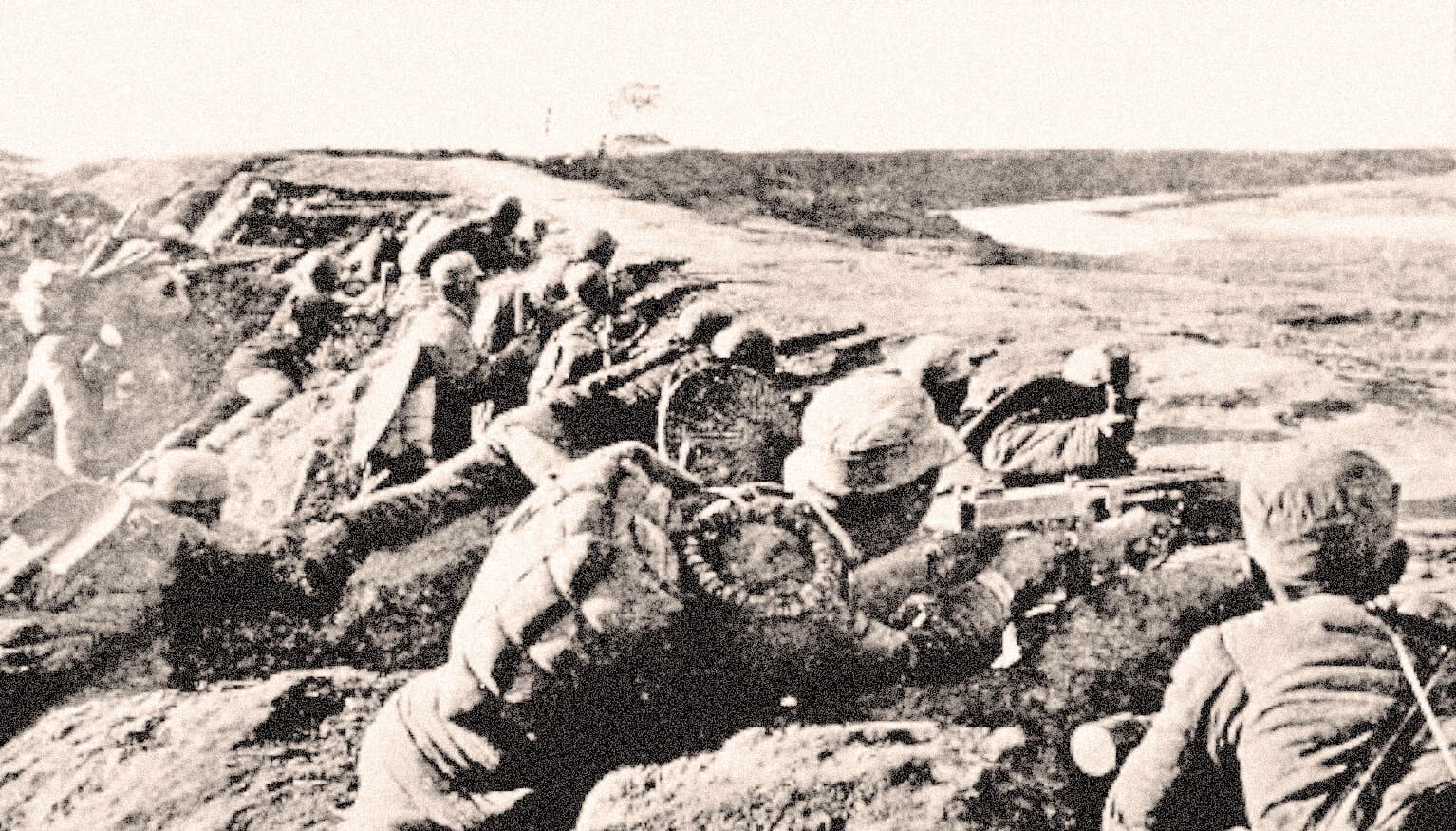 Old black and white photograph of soldiers in trenches during wartime, showcasing historical military scenes and battlefield defense.