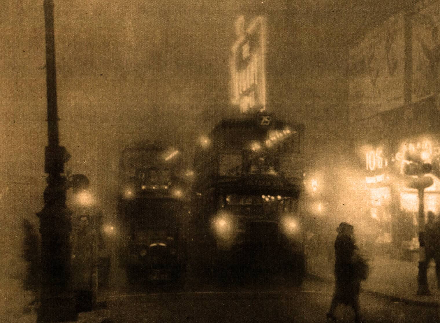 Dusty street scene with vintage trolley cars and pedestrians at night, illuminated by streetlights, capturing historical urban transportation and city life from an era past.