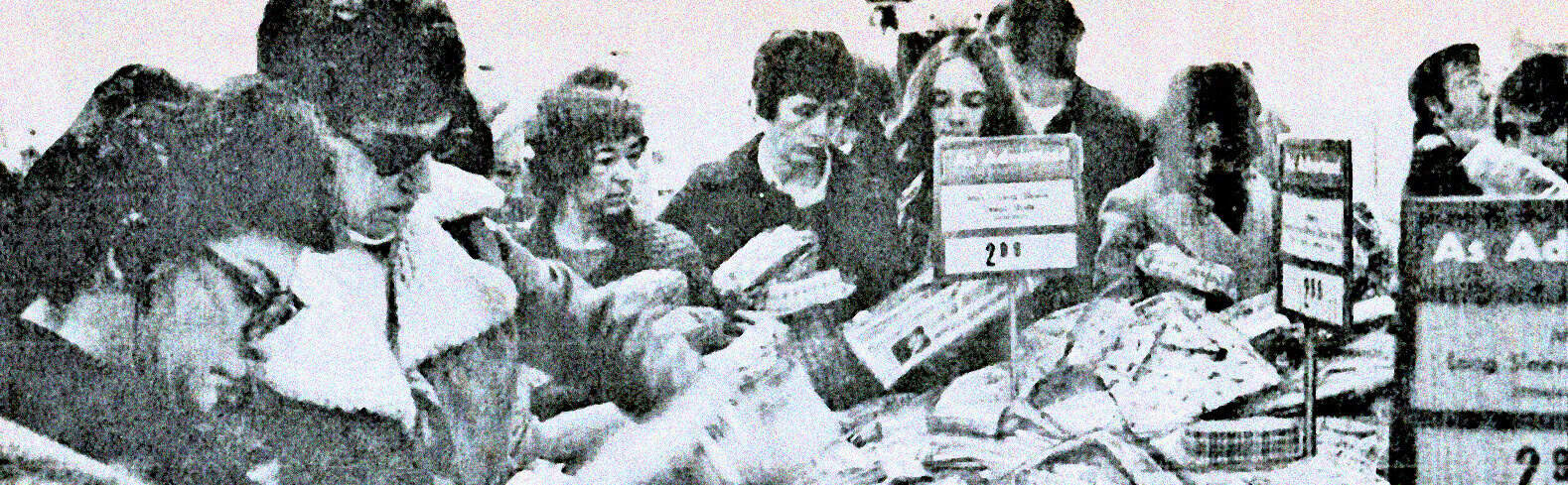 Vintage black and white photo of young students at a school cafeteria enjoying a meal, highlighting historical school dining experiences and emphasizing nostalgia for classic education periods.