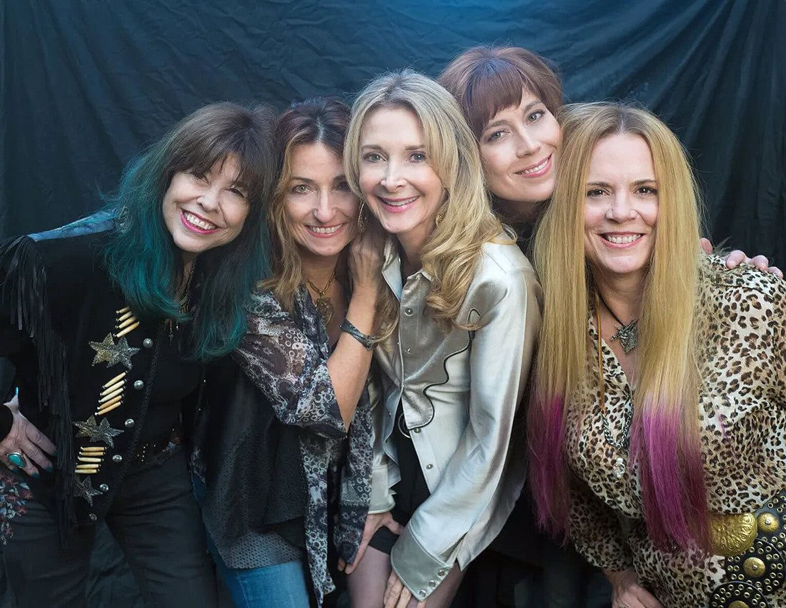 Brightly dressed women in vintage-inspired costumes, celebrating music and history, at a Past Daily event, highlighting nostalgic sound archives, music history, and cultural moments.