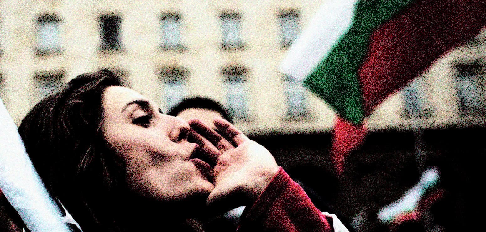 An Italian woman celebrating her country's victory with an Italian flag during a historic event.
