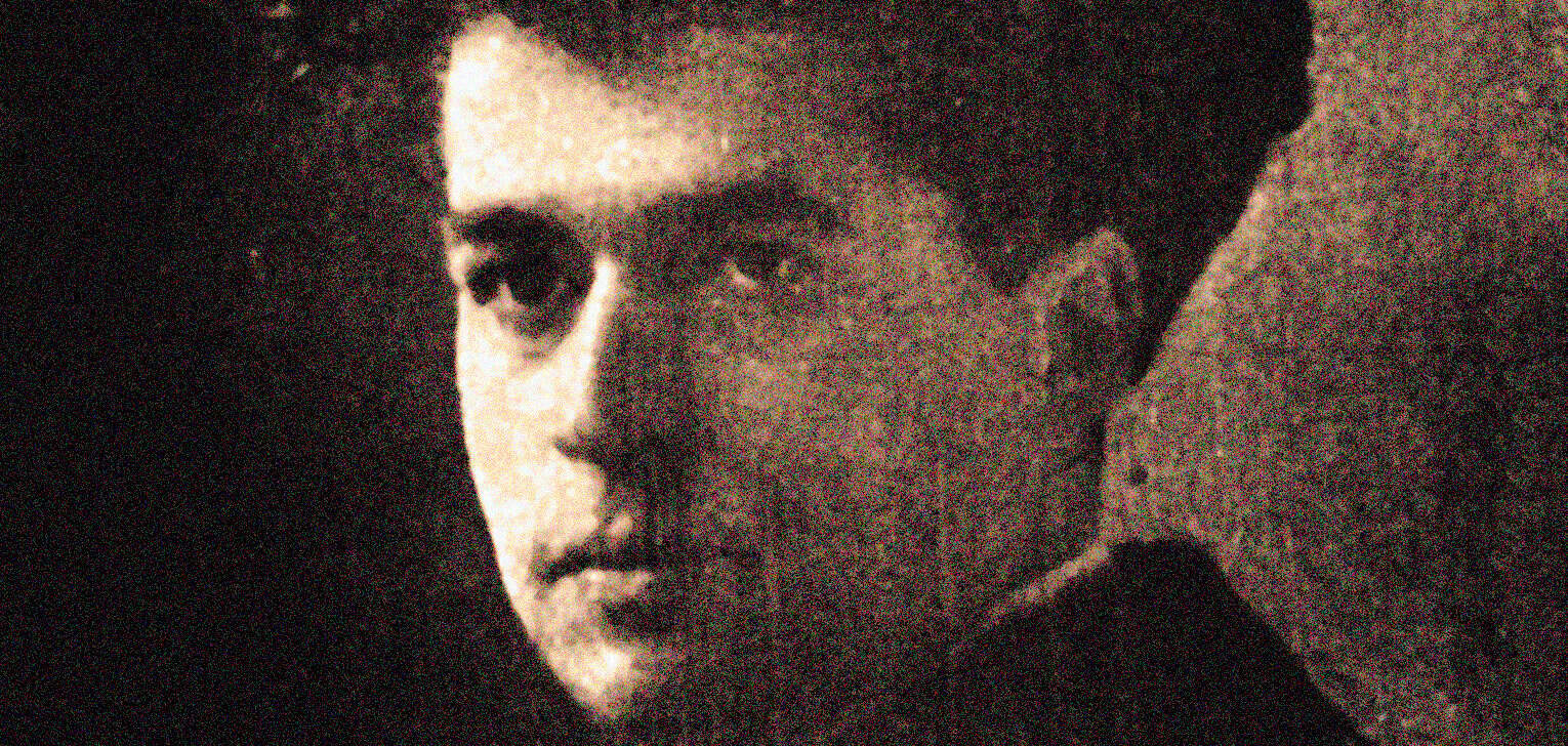 Historic black and white portrait of a young man with intense gaze, classic 1950s style, capturing the essence of vintage news and music archives, reminiscent of Past Daily archives.