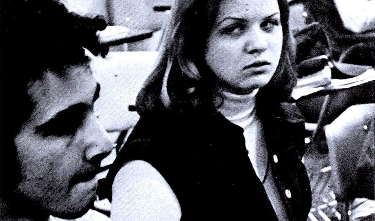 Historic black and white photo of women protesting, capturing expressions of activism and social change, reflecting the history of women's rights and civil rights movements.