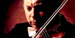 Violinist performing classical music, showcasing a sound archive of historical news and music at Past Daily.