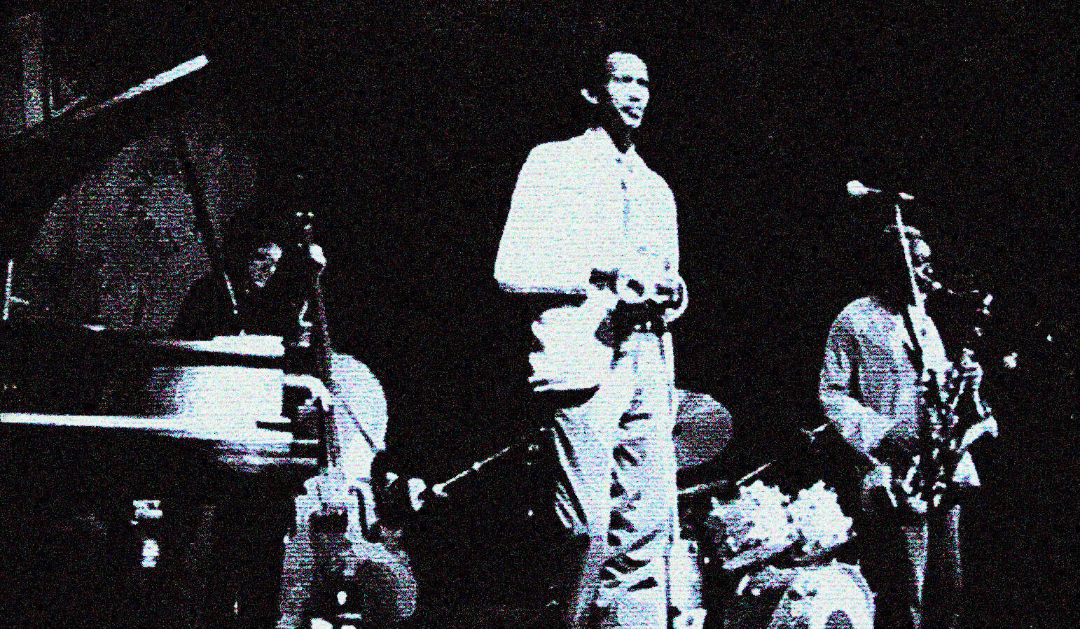 Vintage jazz band performing live on stage with piano, saxophone, and drums, capturing the essence of music history and classic sound recordings featured in the Past Daily sound archive.