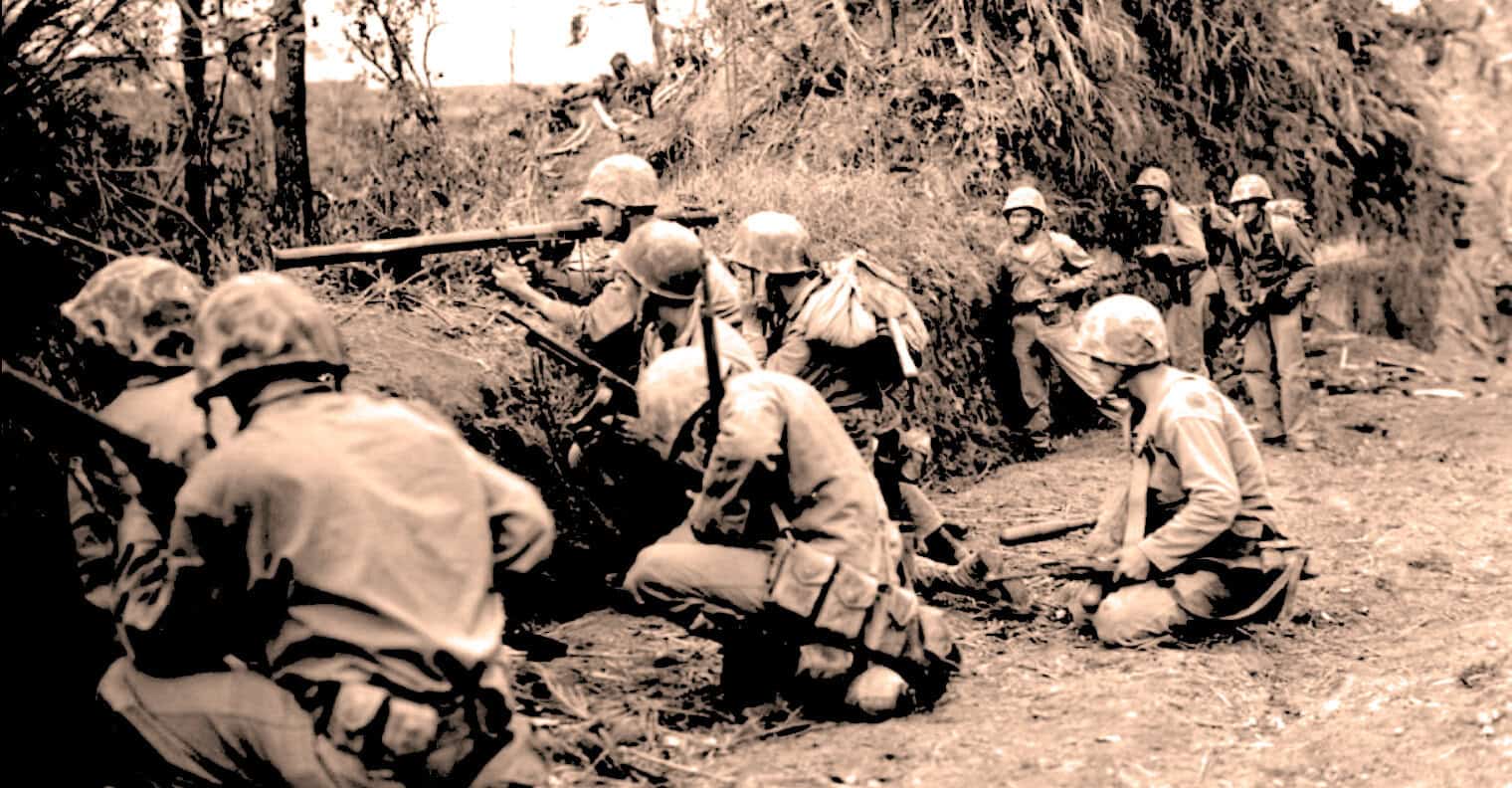 Medics tending to soldiers during war, historical military scene, soldiers with helmets and rifles in trench warfare, black and white WWII combat photo, archival news and history imagery.