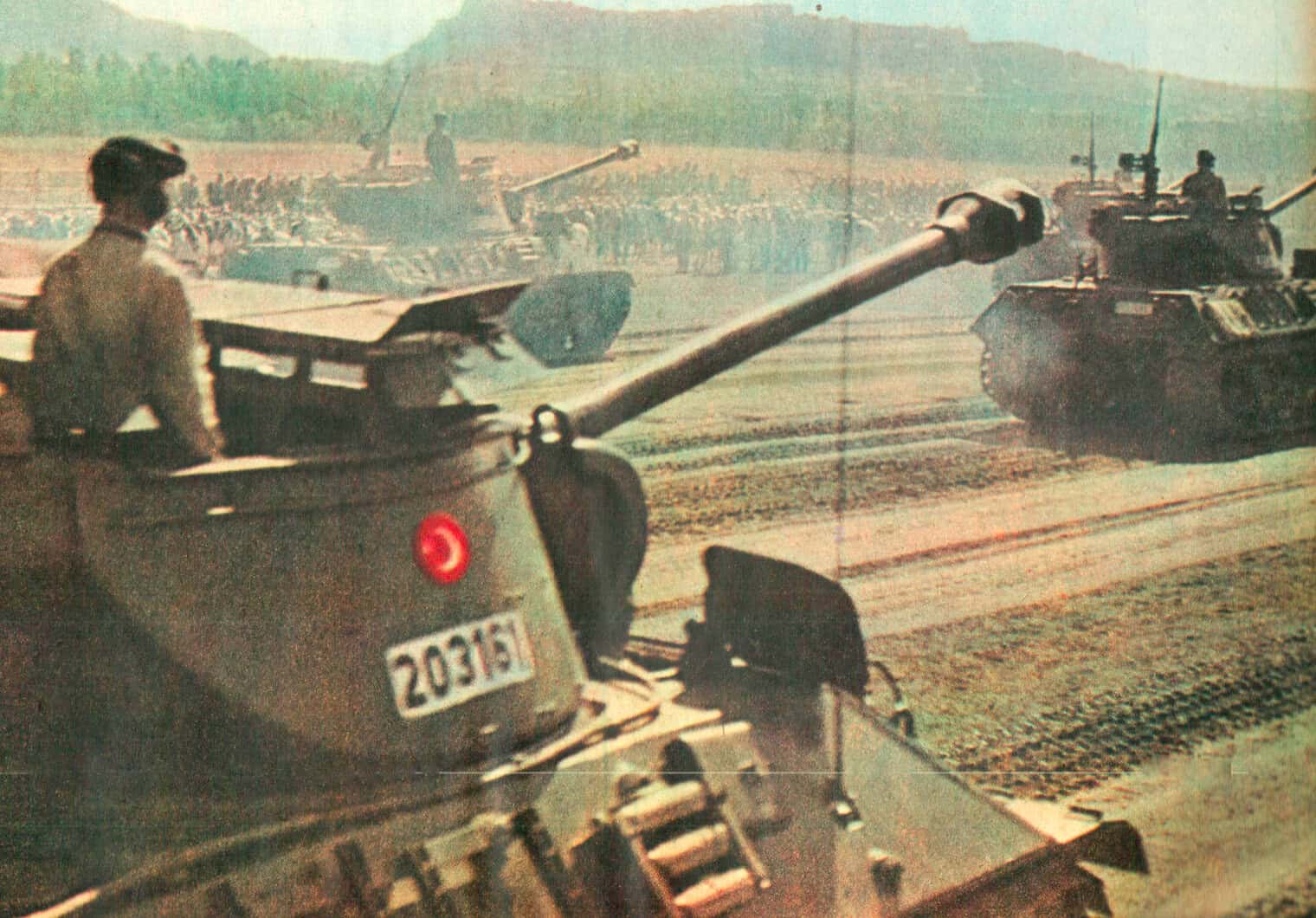 Armored tanks military vehicles on a battlefield with soldiers, historical wartime scene, emphasizing military news and history archive.