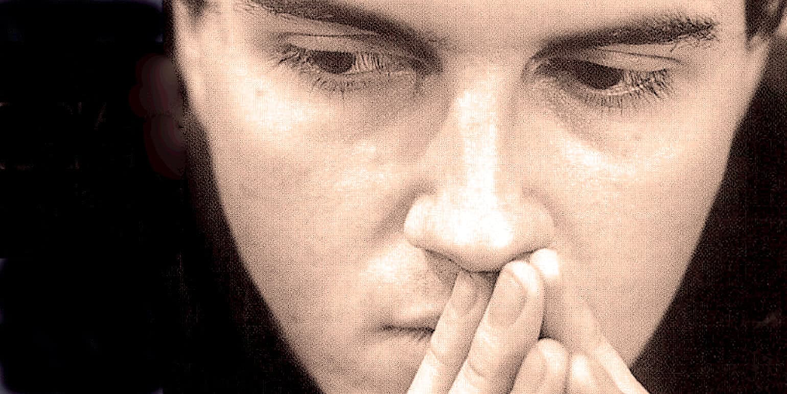 Close-up of a woman with contemplative expression, symbolizing reflection on music, news, and history from past daily archives, emphasizing sound archive, historical significance, and archival audio content.