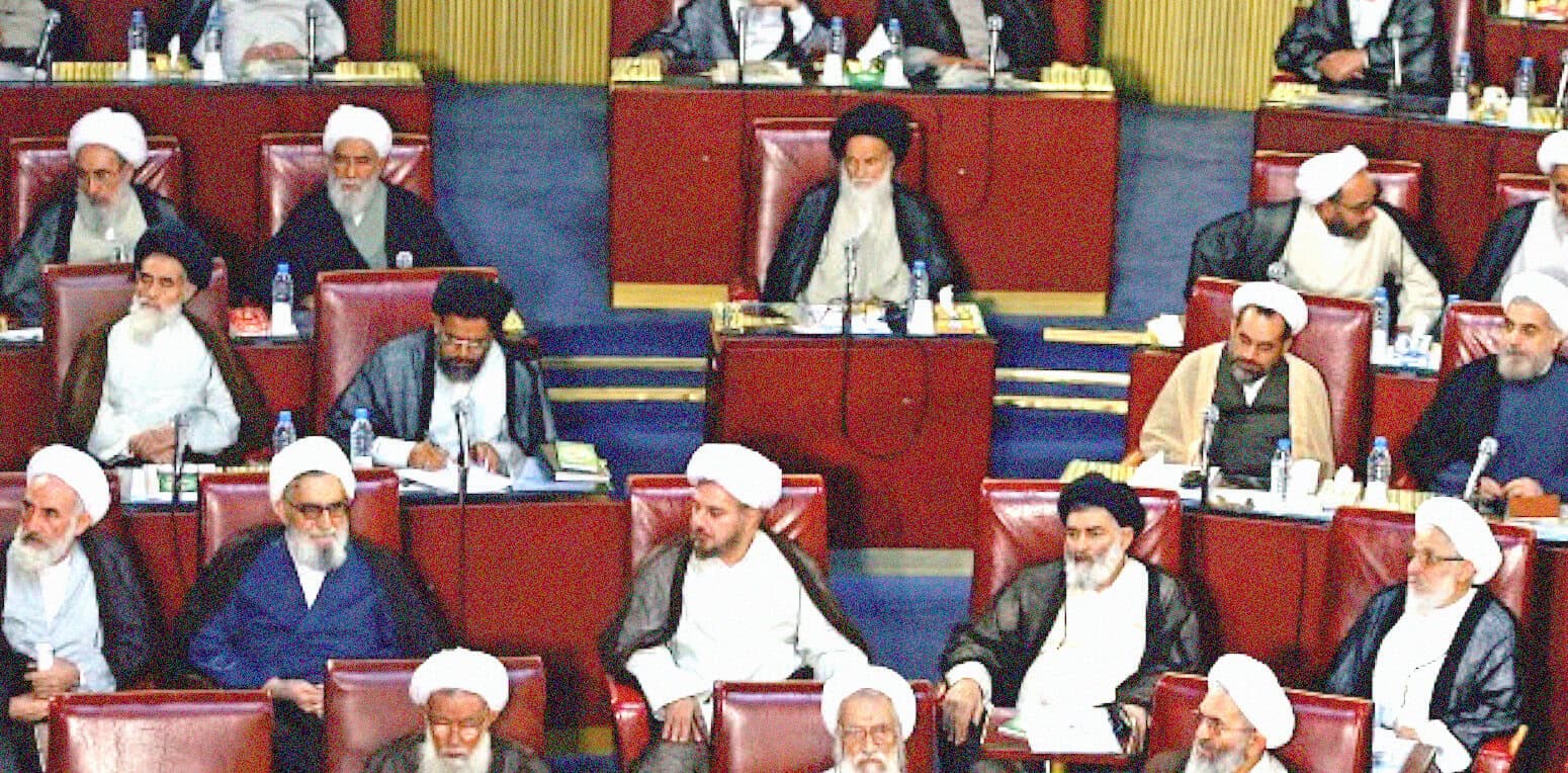 Senior Islamic scholars and government officials in a parliamentary session discussing religious and political issues, traditional attire and religious leaders in a formal government meeting, Middle Eastern political assembly with Muslim clerics and dignitaries.
