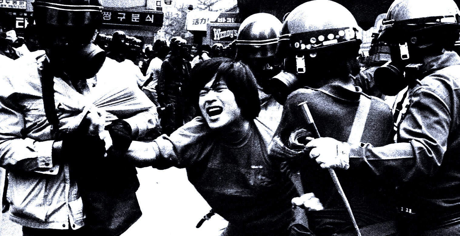 Police confronting protester during demonstration, black and white photo, historic news event, civil unrest, activism, social protest, archival news footage, Past Daily sound archive of news and history.
