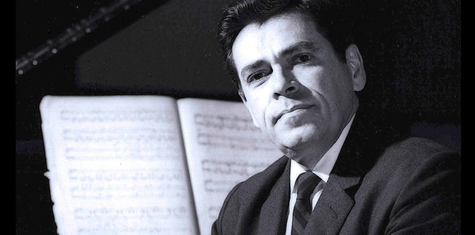 Portrait of a man in formal attire with sheet music in the background, capturing a moment of music history.