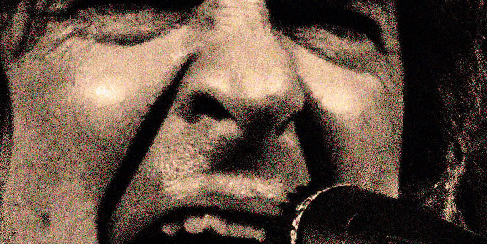 Vintage microphone close-up of a singer performing at Past Daily: a sound archive of news, history, and music, capturing important moments in audio history and cultural storytelling.