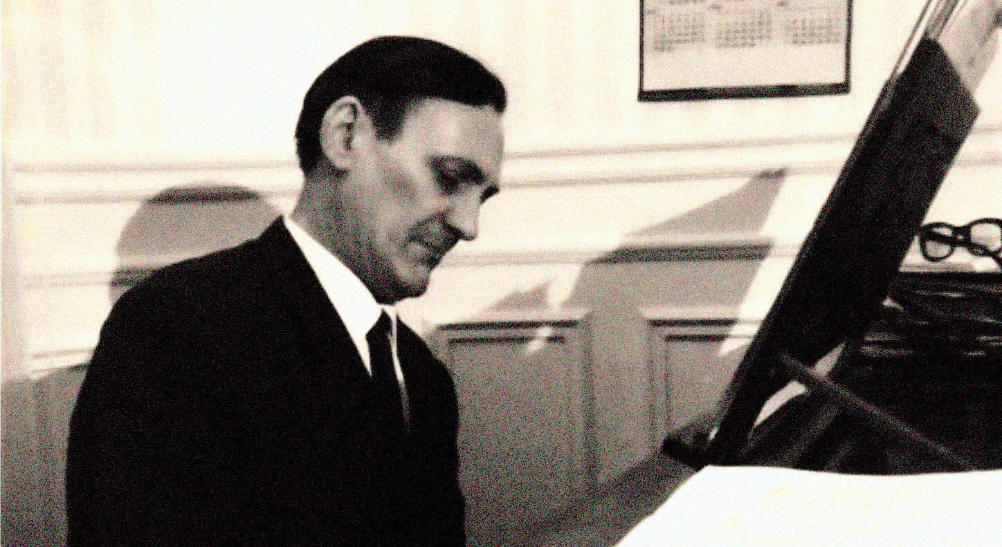 Vintage jazz musician playing piano, black and white photo, iconic artists, musical history, vintage music archive, Past Daily archival image, historic music recording, 20th-century music scene, classic jazz performance, historical music documentation, black-and-white vintage photo, retro music imagery, archival music photography, timeless jazz moments, vintage music history, black and white historical photo, classic jazz artist, old-school music scene, legendary musician, vintage sound archive relevance.