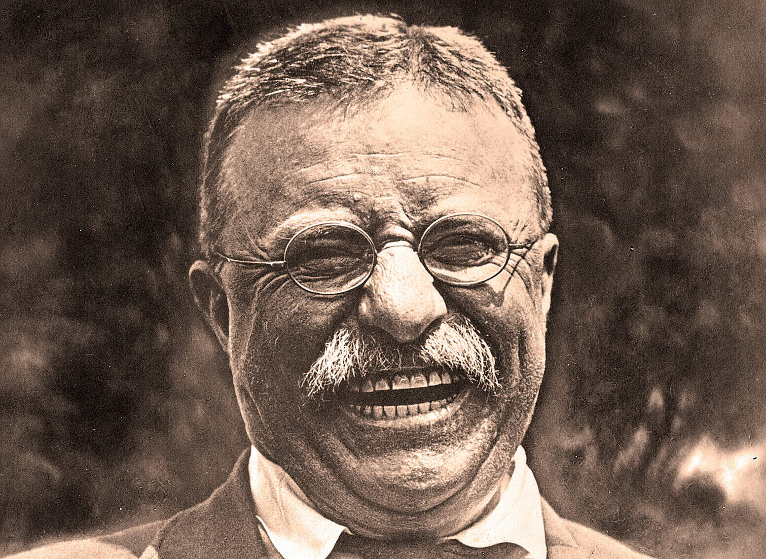 Smiling elderly man with glasses, captured in vintage style, representing historical figures or news commentary.