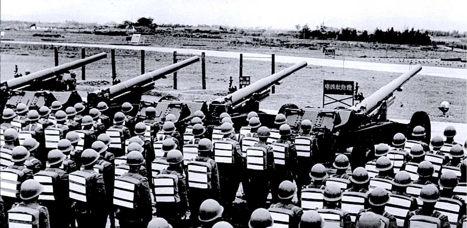 Military artillery during wartime, soldiers in uniform with helmets, historical black and white photo emphasizing war history, military news, and defense archives.