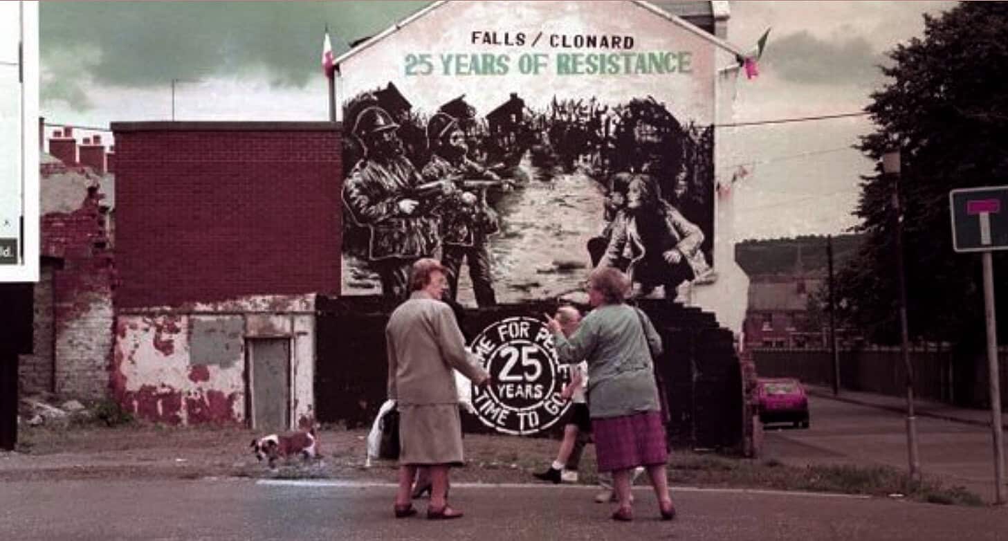 Historic mural commemorating 25 years of resistance by Falls/Clonard community in Belfast, Northern Ireland, depicting local history and activism.
