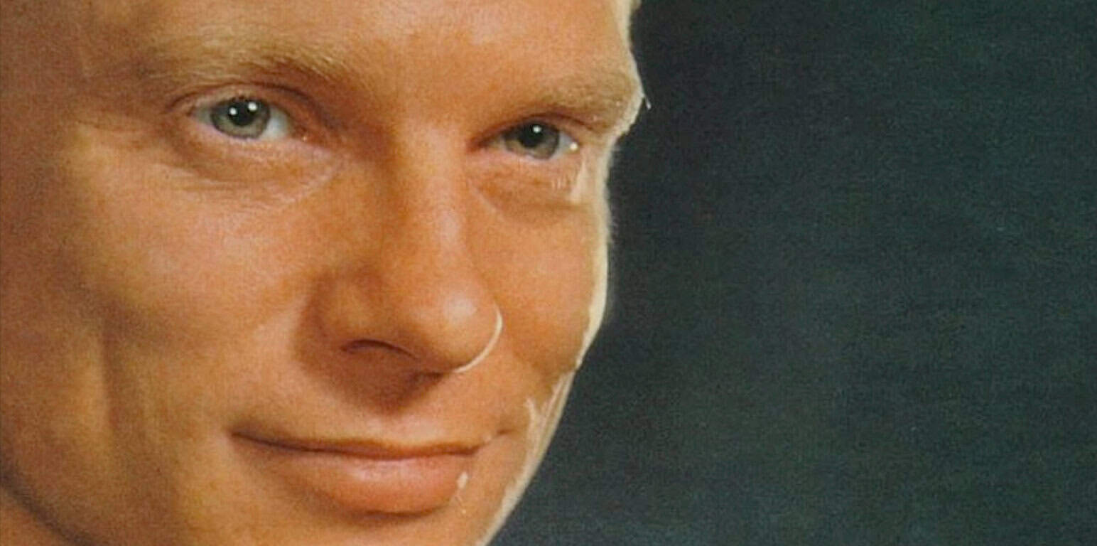 Close-up of a person's face with blue eyes and fair skin, emphasizing expressive features, ideal for illustrating historical sound archives, news, music, and memorable moments from Past Daily.