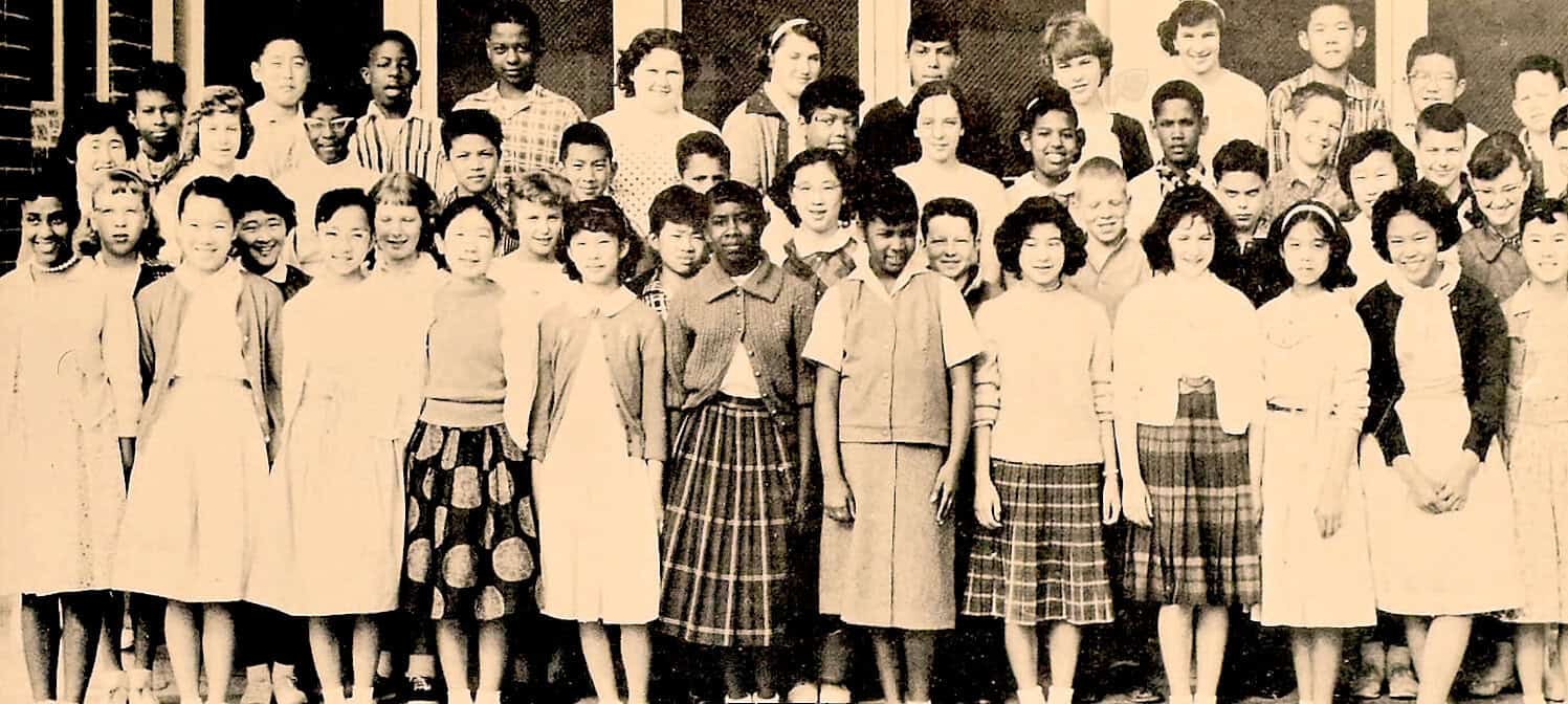 Children classroom group photo during the 1950s with diverse students and teachers, capturing historical moments in education, music, and history for archival purposes.
