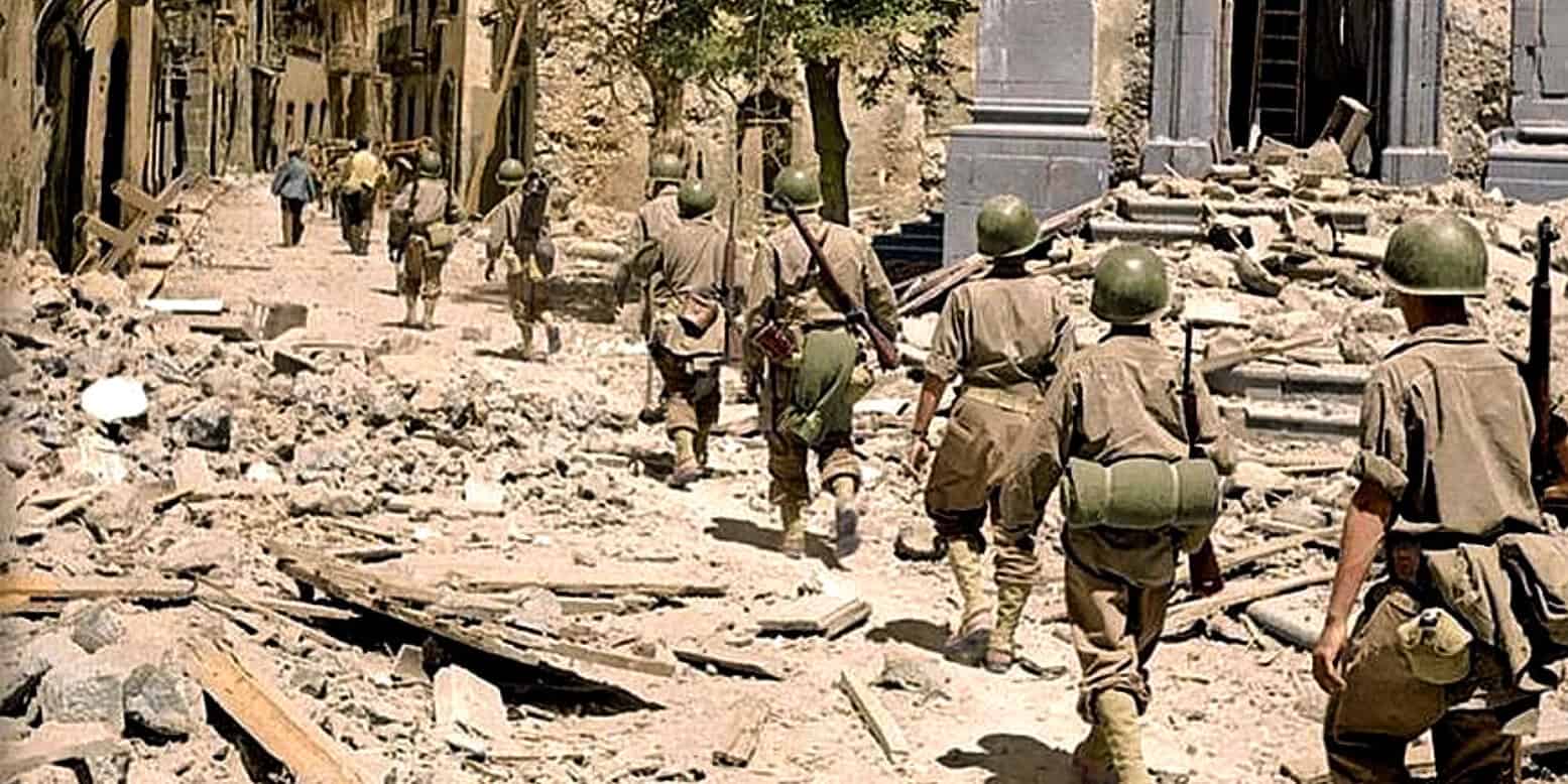 Soldiers walking through rubble and destruction in a war-torn city streets, illustrating conflict, military history, and urban devastation.